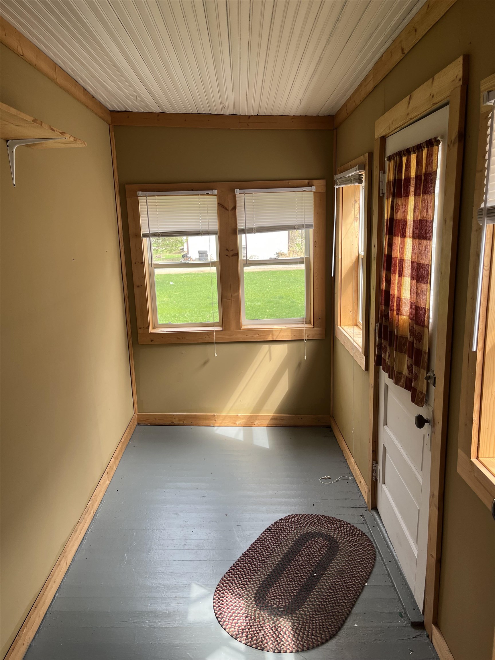 235 North Stockton Street Stockton, IL 61085 - Photo 12 of 18 an empty room with wooden floor and windows