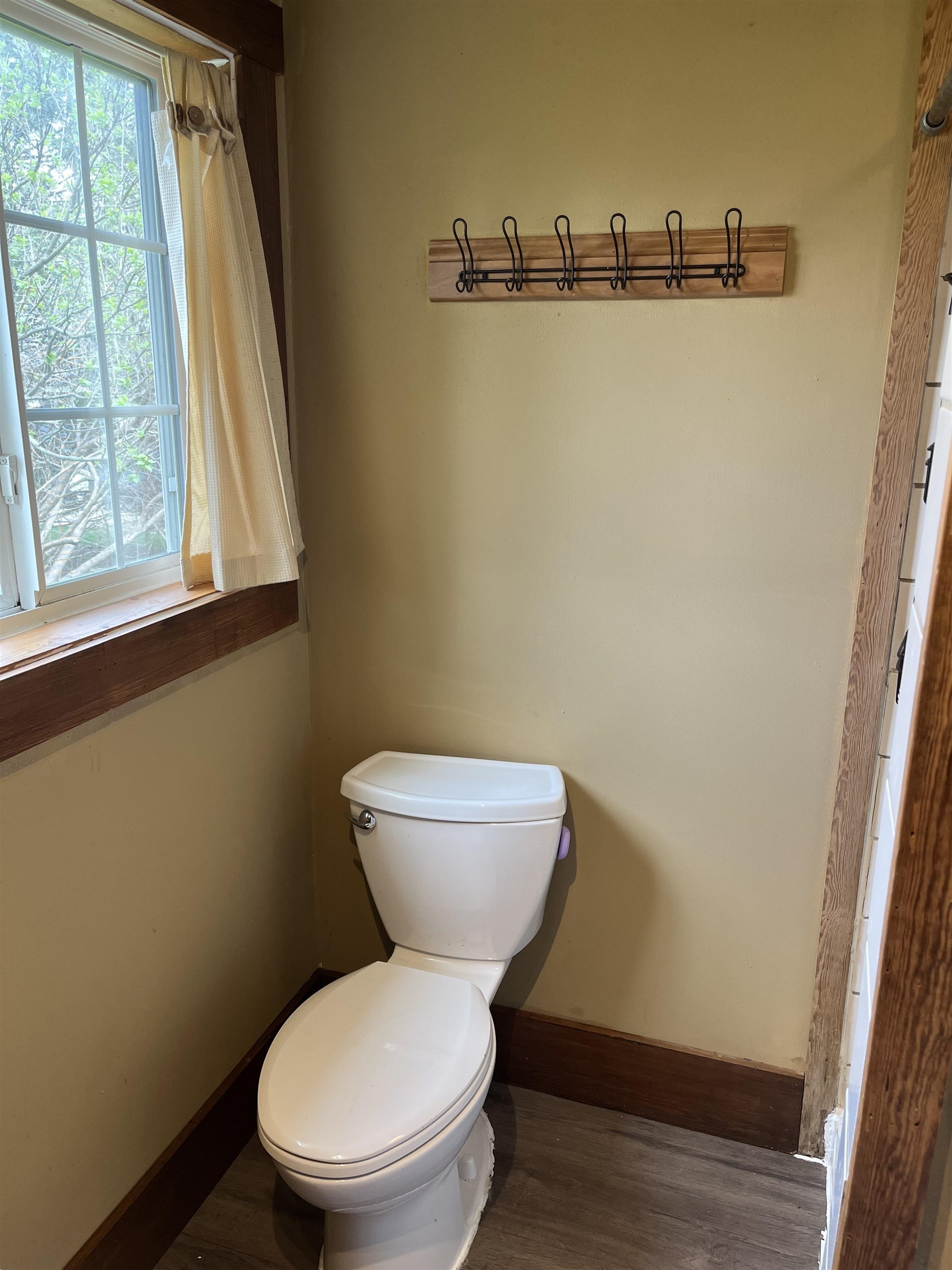 235 North Stockton Street Stockton, IL 61085 - Photo 13 of 18 a white toilet sitting next to a window