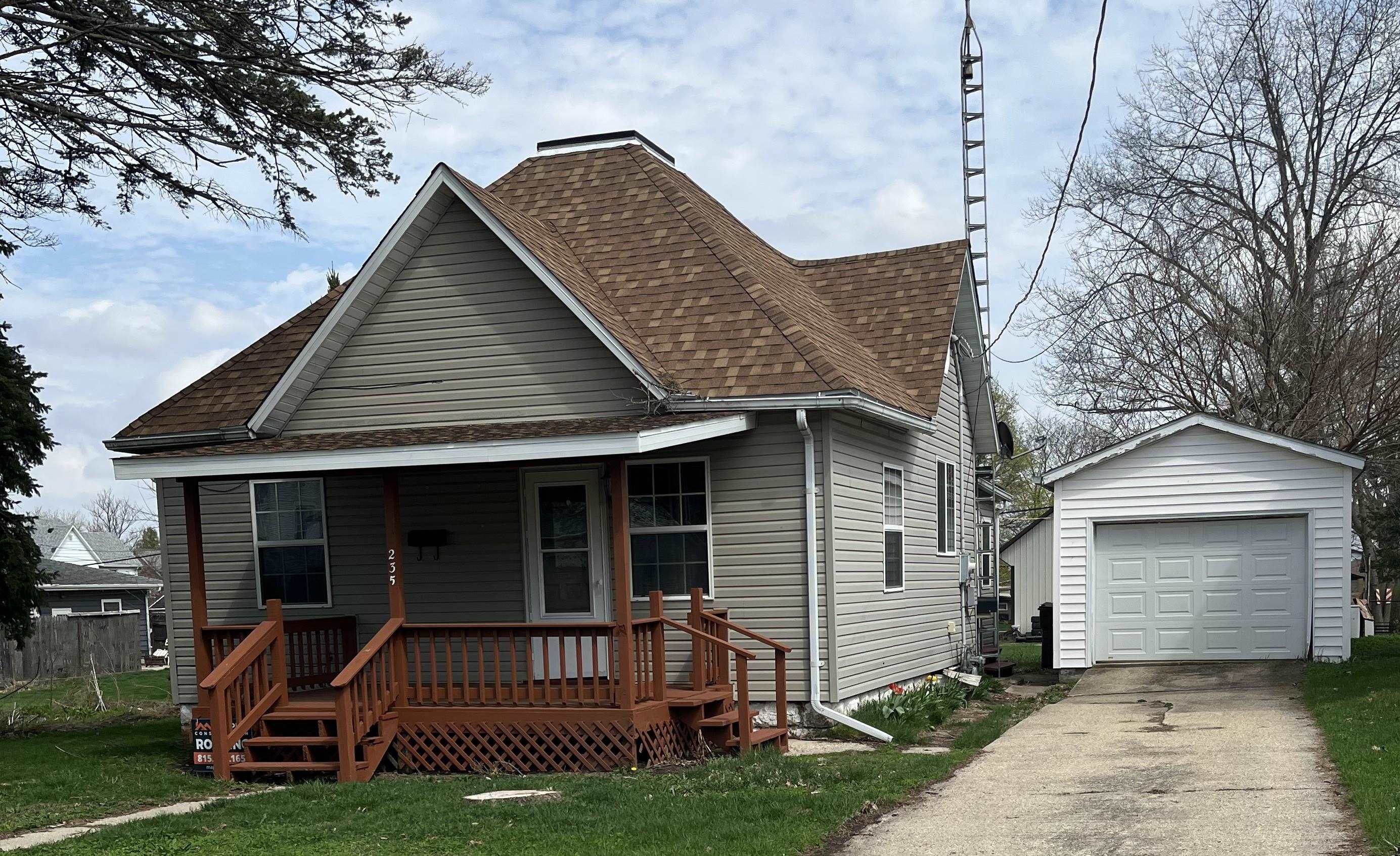 235 North Stockton Street Stockton, IL 61085 - Photo 2 of 18 a view of a house with a yard porch and sitting area