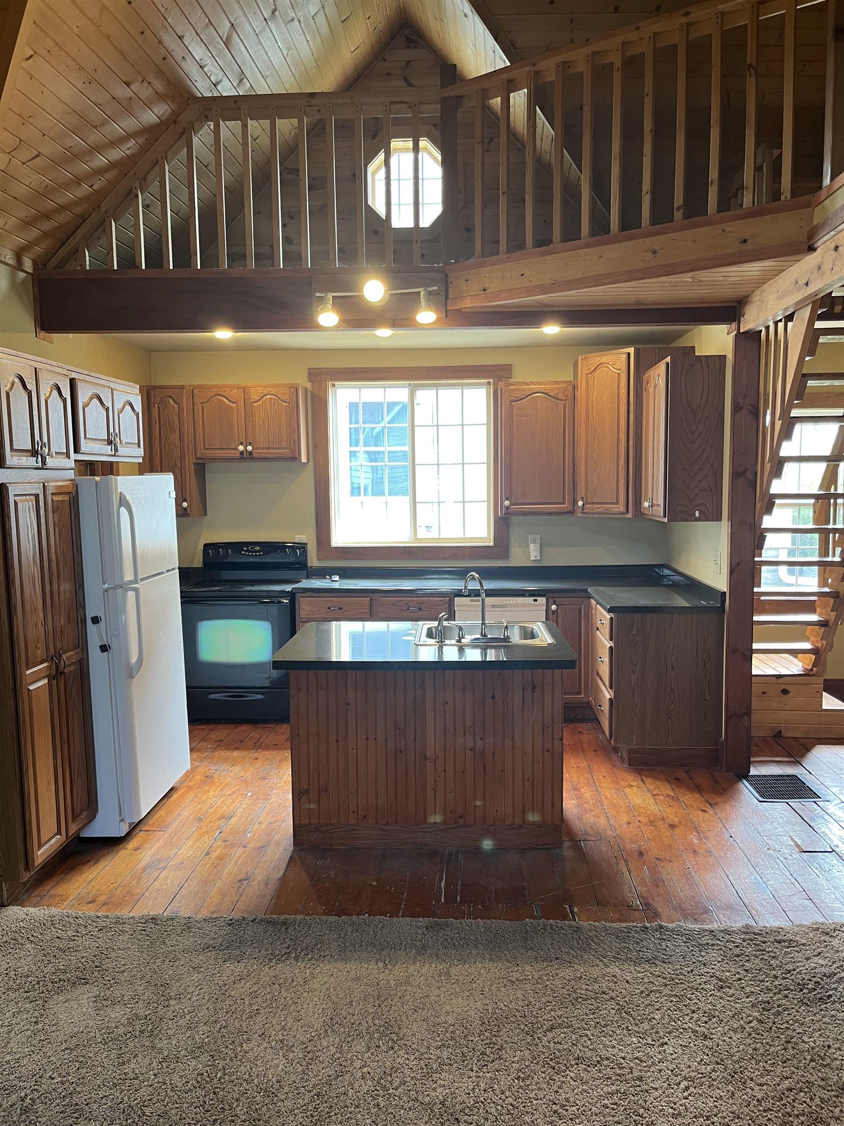 235 North Stockton Street Stockton, IL 61085 - Photo 6 of 18 a kitchen with refrigerator and window