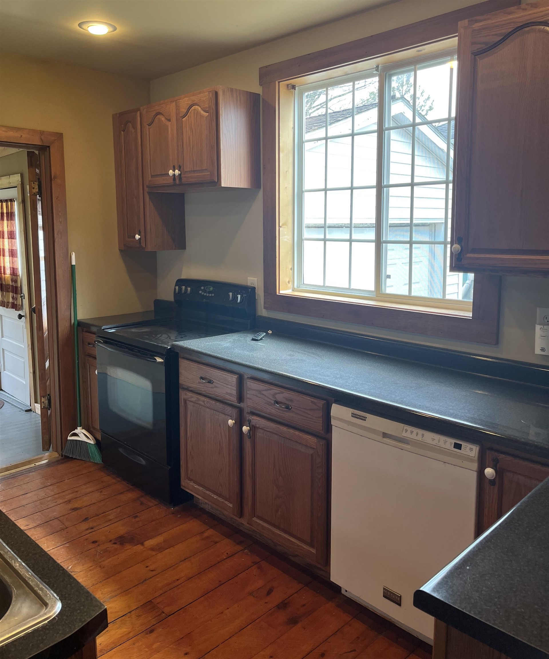 235 North Stockton Street Stockton, IL 61085 - Photo 7 of 18 a kitchen with a sink cabinets and window