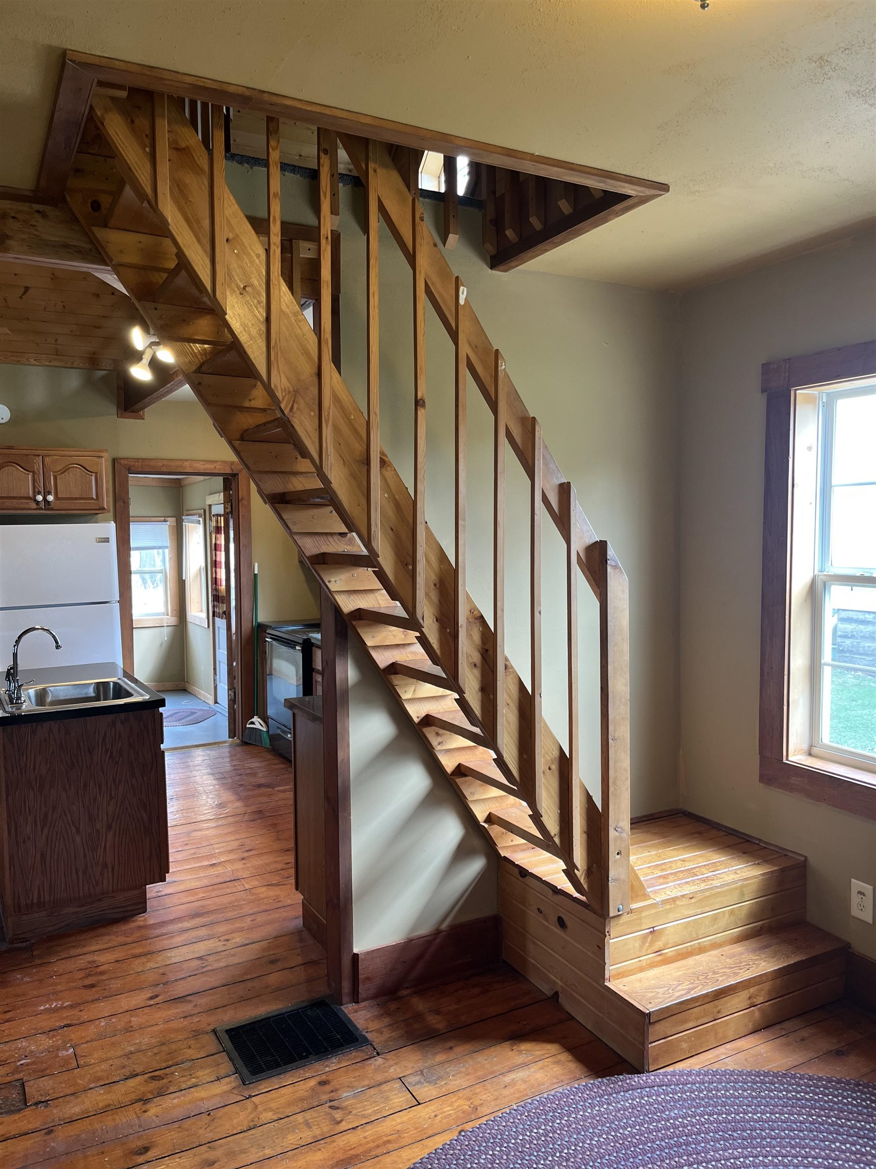 235 North Stockton Street Stockton, IL 61085 - Photo 8 of 18 a view of entryway and hall with wooden floor