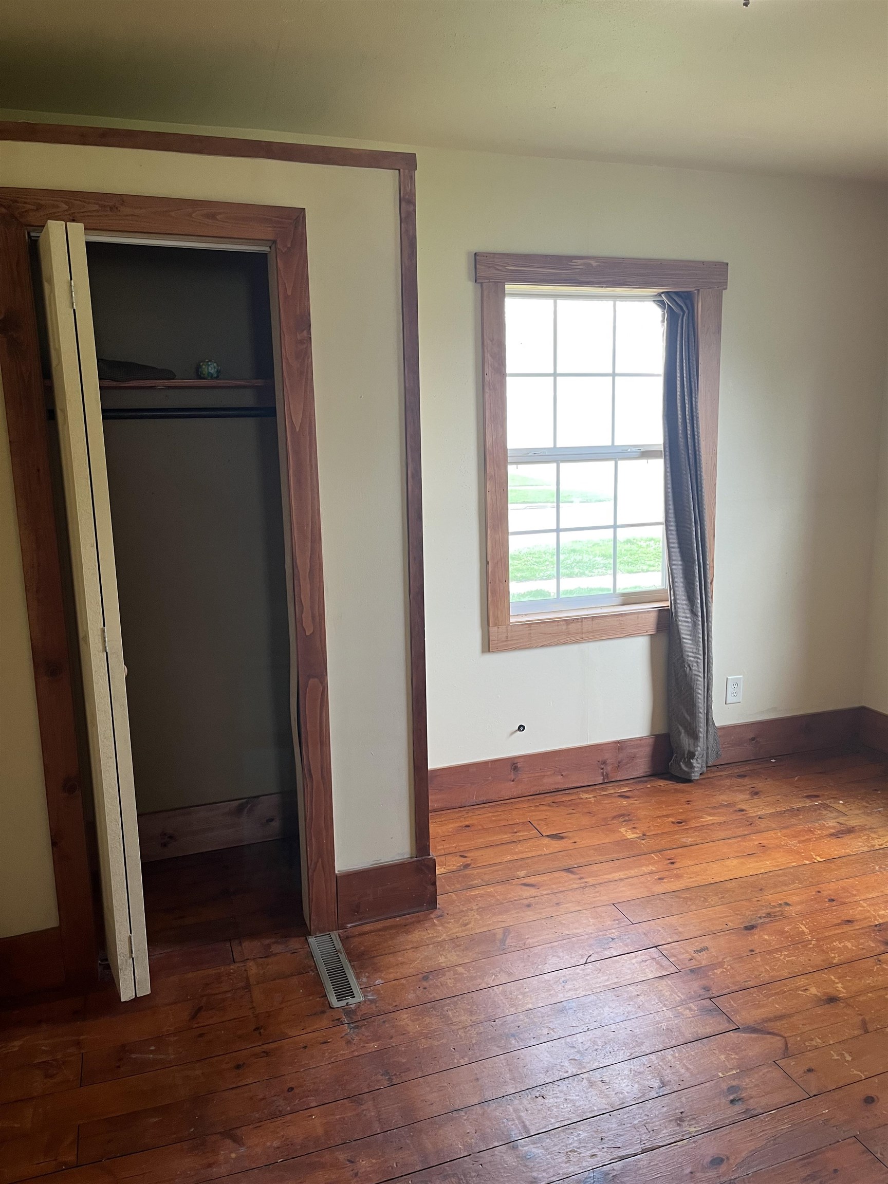 235 North Stockton Street Stockton, IL 61085 - Photo 9 of 18 an empty room with closet and windows