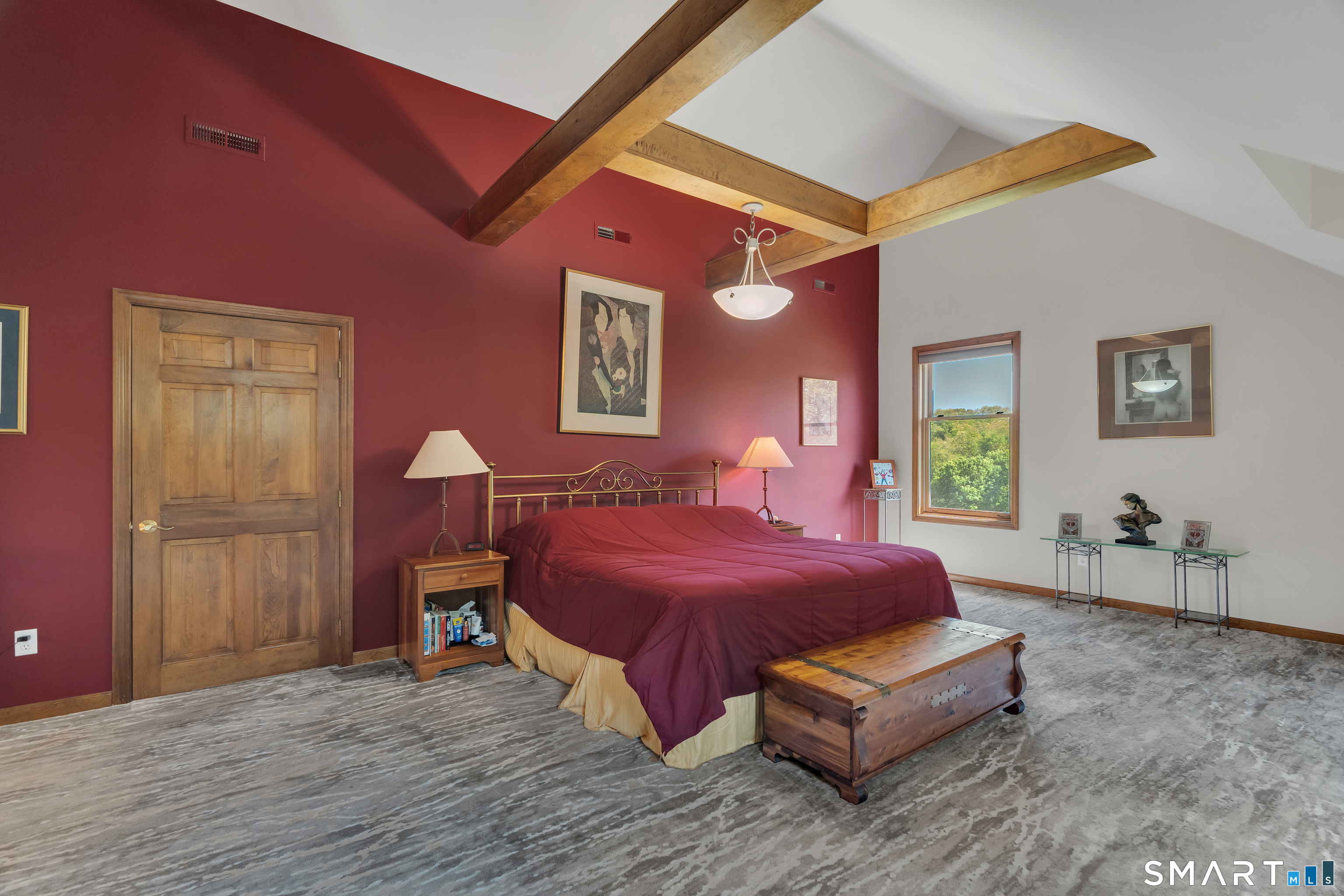 194 Quaker Farms Road Oxford, CT 06478 - Photo 19 of 40 a spacious bedroom with a bed and wooden floor