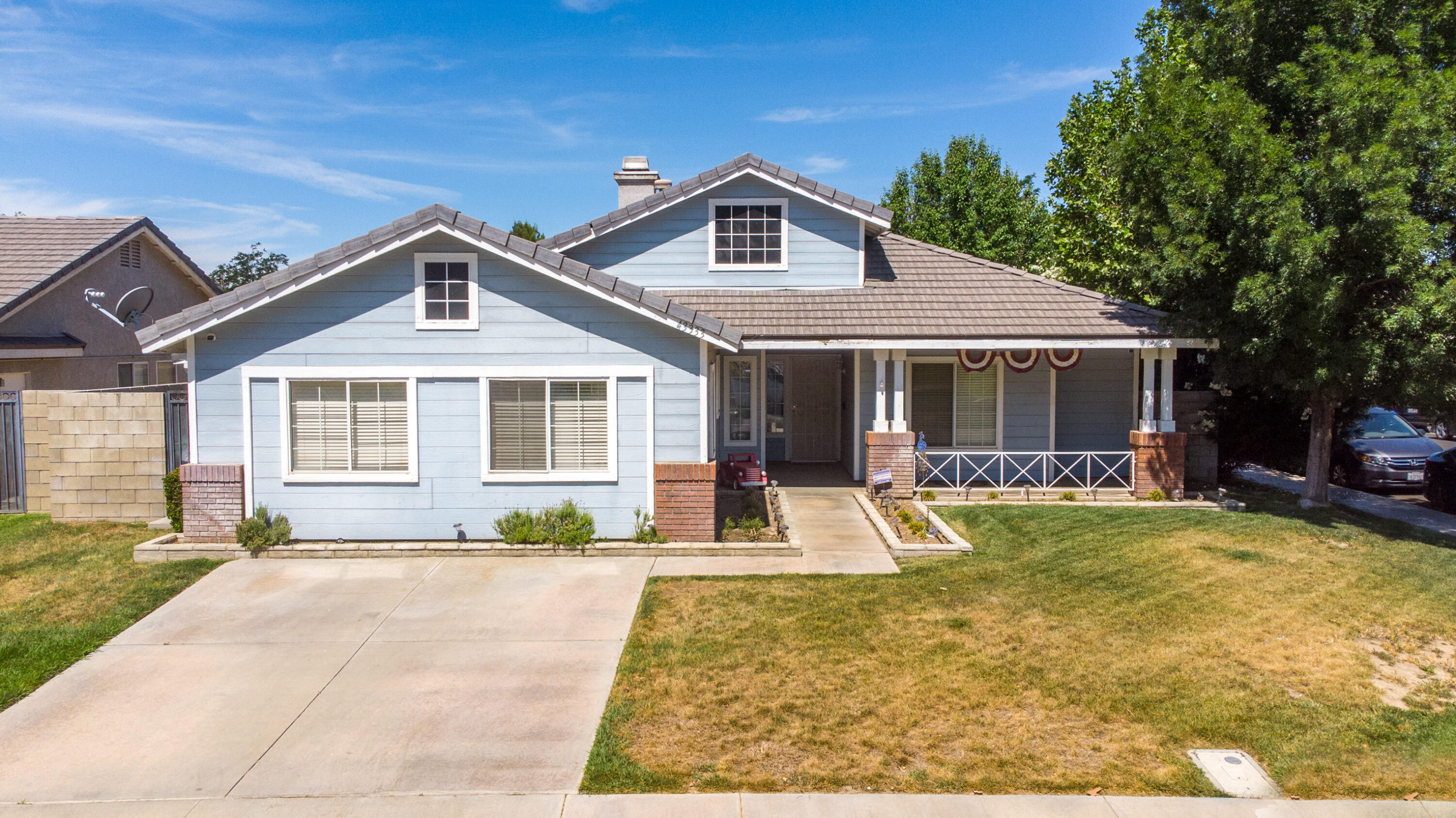 43333 Vineyard Drive Lancaster, CA 93535 - Photo 1 of 31 a front view of a house with a yard outdoor seating and barbeque oven