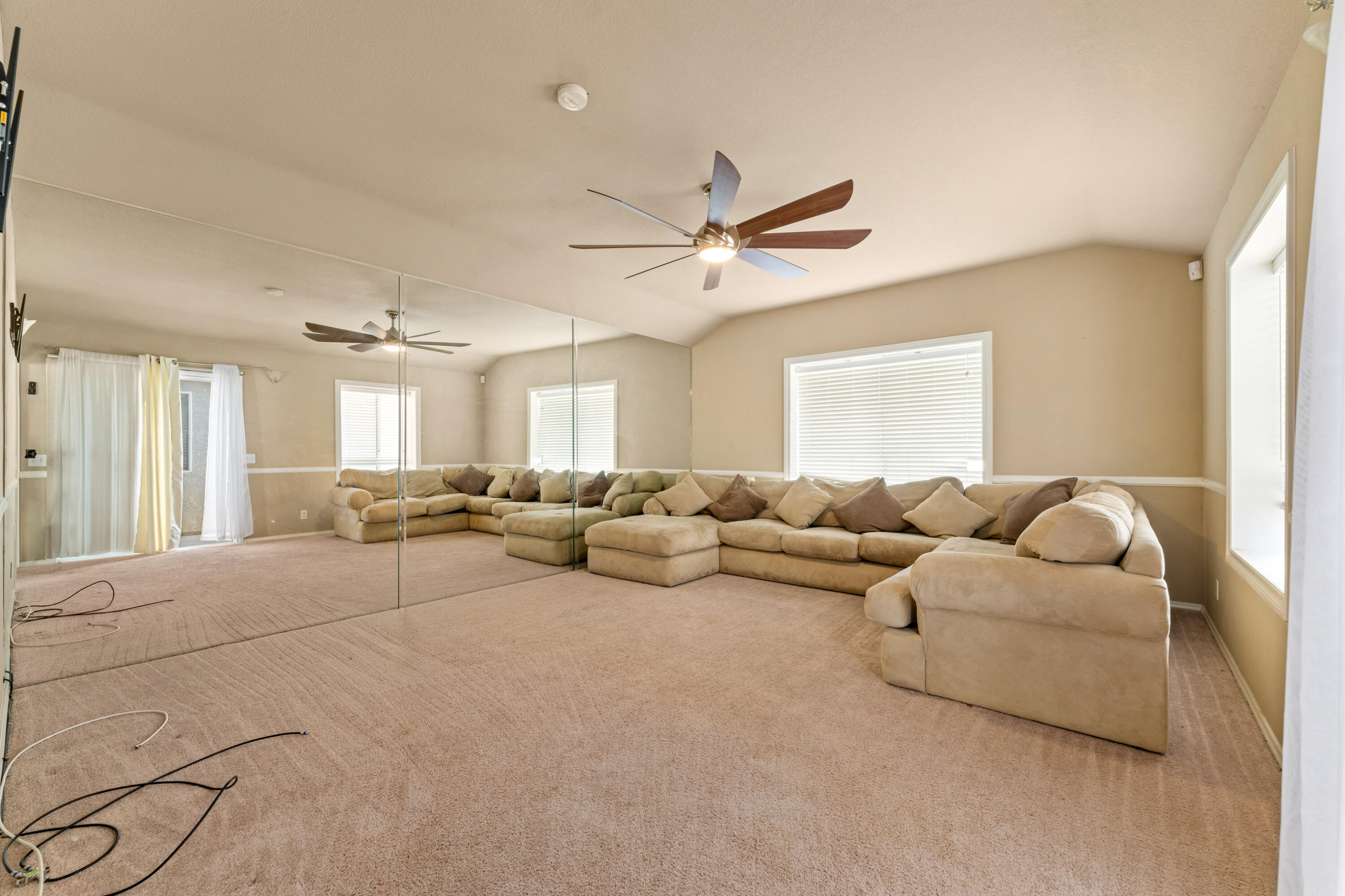 43333 Vineyard Drive Lancaster, CA 93535 - Photo 17 of 31 a living room with furniture and a ceiling fan