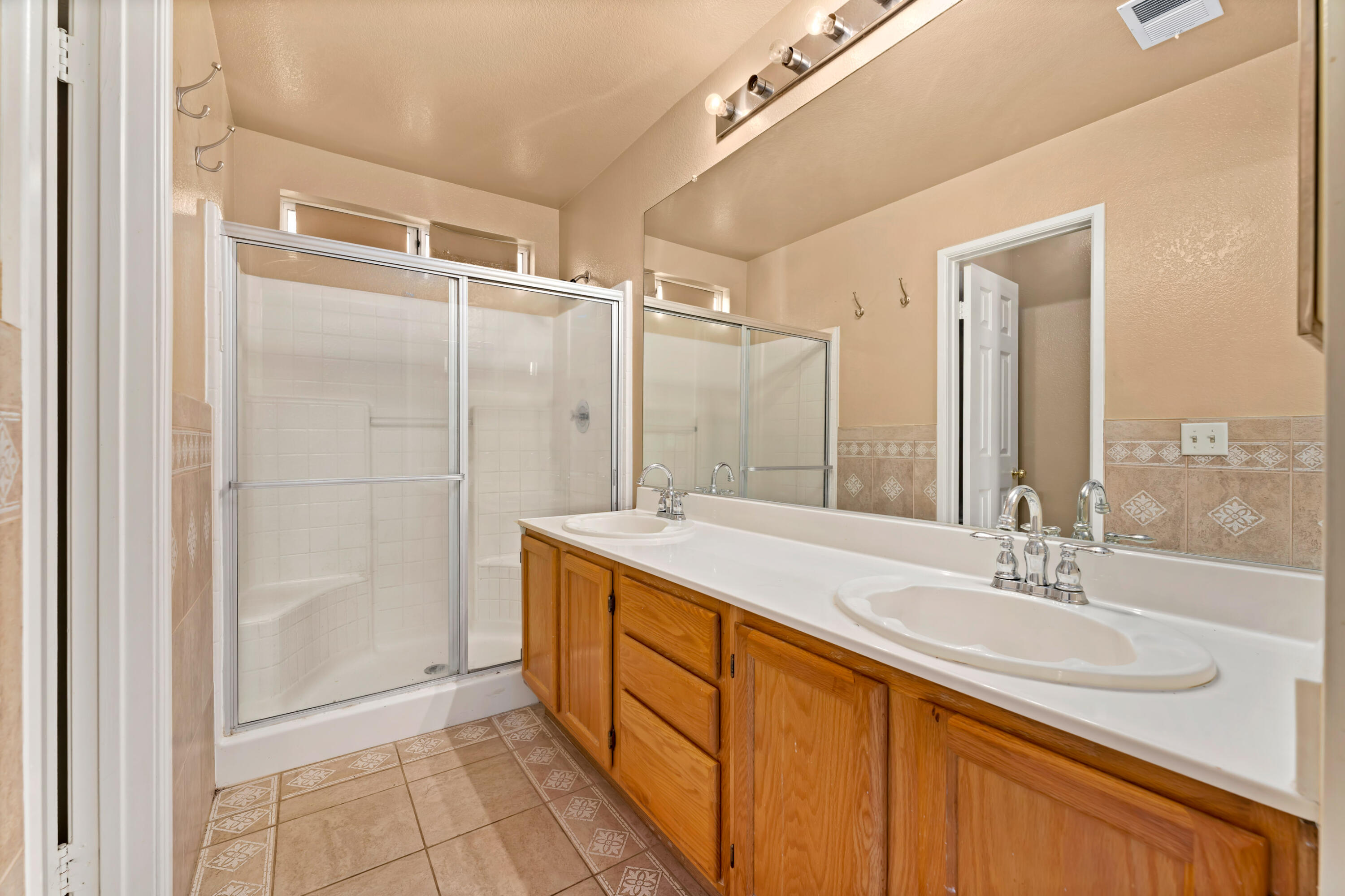 43333 Vineyard Drive Lancaster, CA 93535 - Photo 25 of 31 a bathroom with a granite countertop sink and a mirror