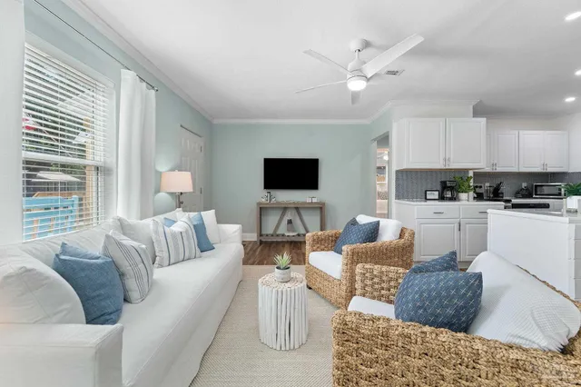 a living room with furniture and a flat screen tv