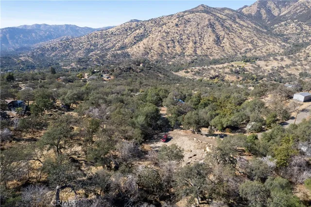 a view of a city with mountains in the background