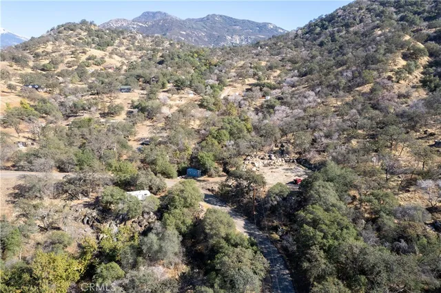 a view of a mountain range with trees