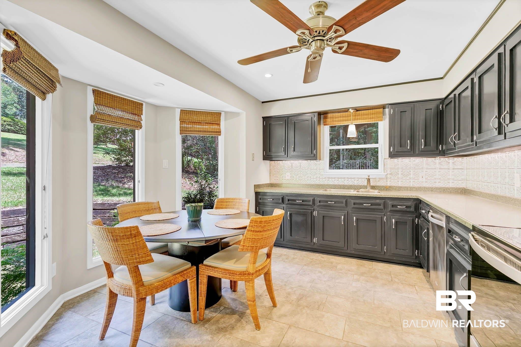 332 Ridgewood Drive Daphne, AL 36526 - Photo 17 of 48 Kitchen featuring tasteful backsplash, light countertops, dark cabinetry, recessed lighting, and ceiling fan