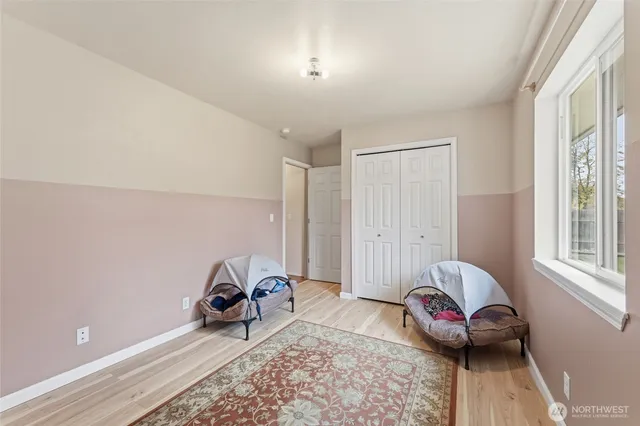 a spacious bathroom with a granite countertop sink a mirror and shower