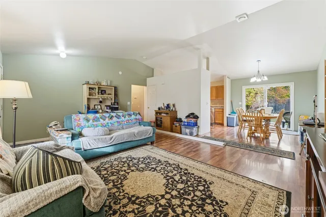 a living room with furniture and a rug