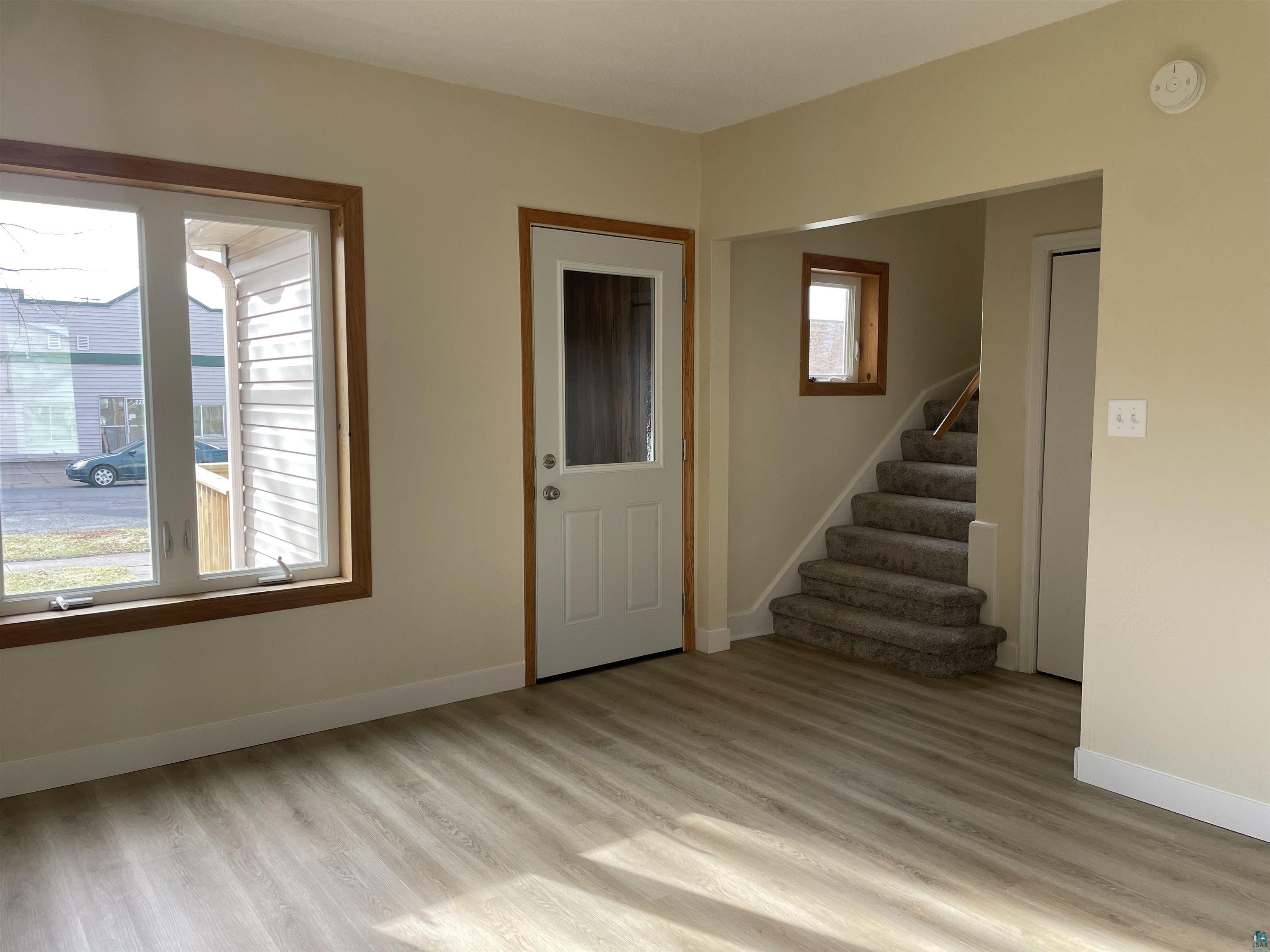 219 4th Street Proctor, MN 55810 - Photo 15 of 25 Foyer featuring plenty of natural light and light hardwood / wood-style flooring