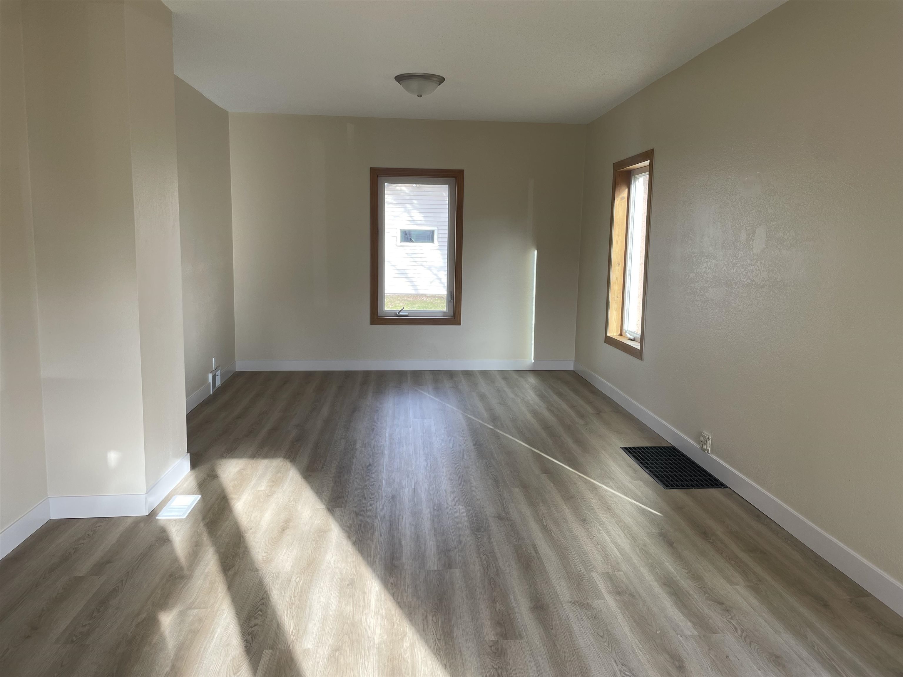 219 4th Street Proctor, MN 55810 - Photo 7 of 25 Empty room with wood-type flooring