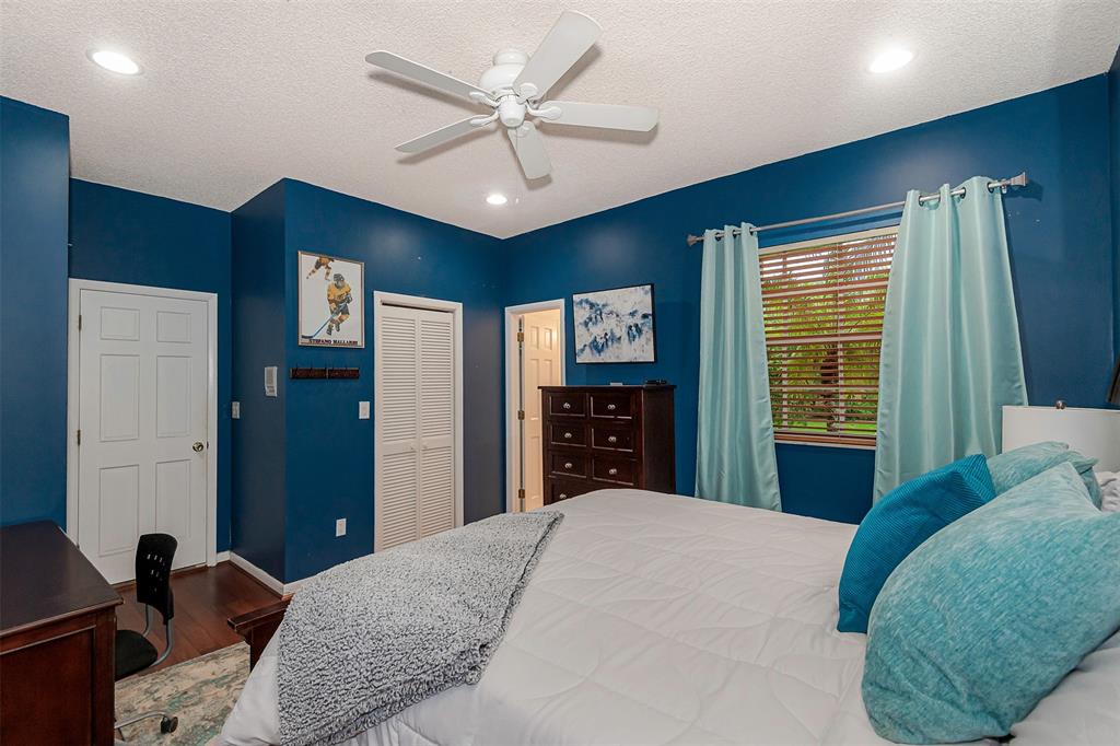 Davie Davie, FL 33330 - Photo 25 of 57 a bedroom with a large bed and a chandelier