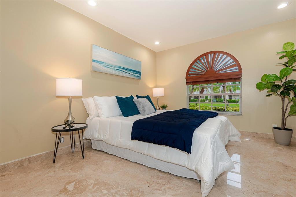 Davie Davie, FL 33330 - Photo 27 of 57 a bedroom with a bed and a lamp