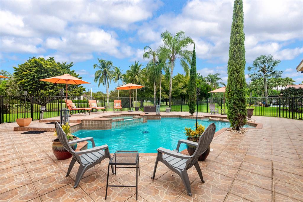 Davie Davie, FL 33330 - Photo 32 of 57 a view of a backyard with swimming pool and sitting area