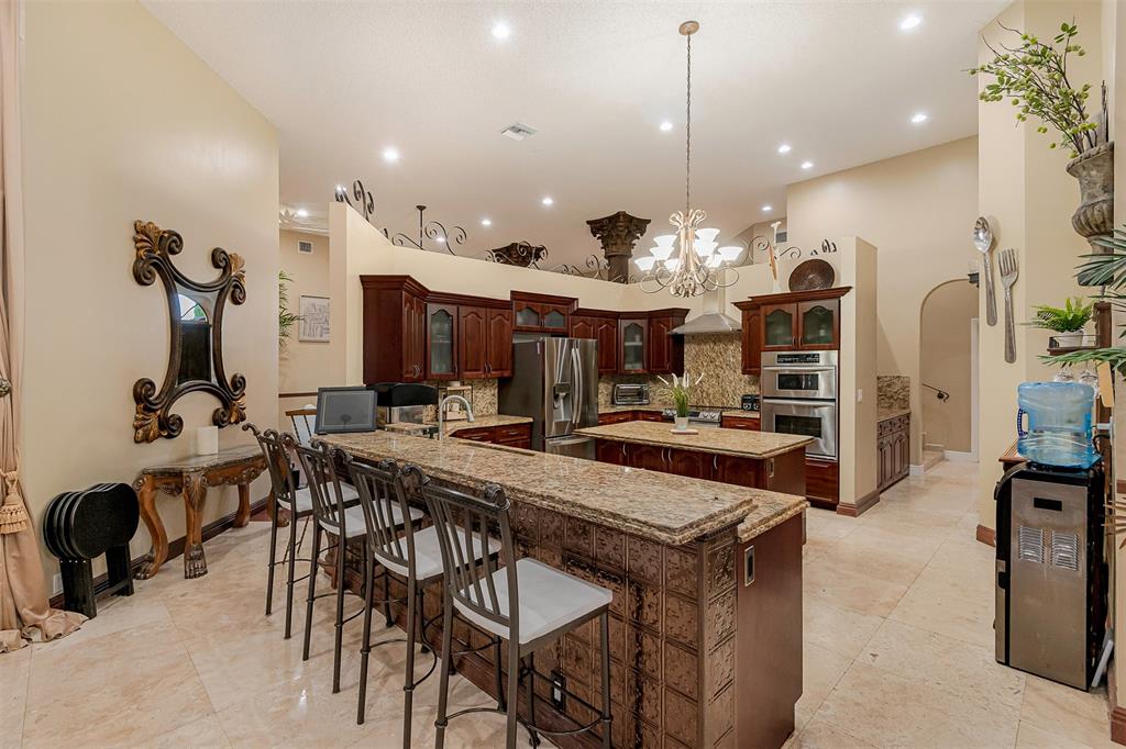 Davie Davie, FL 33330 - Photo 8 of 57 a view of a dining room with furniture and a chandelier