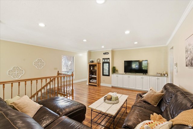 1334 Ridgewood Lane Bountiful, UT 84010 - Photo 9 of 38 Recessed lighting, wood-finish flooring, white built-in cabinetry, and wood staircase railing