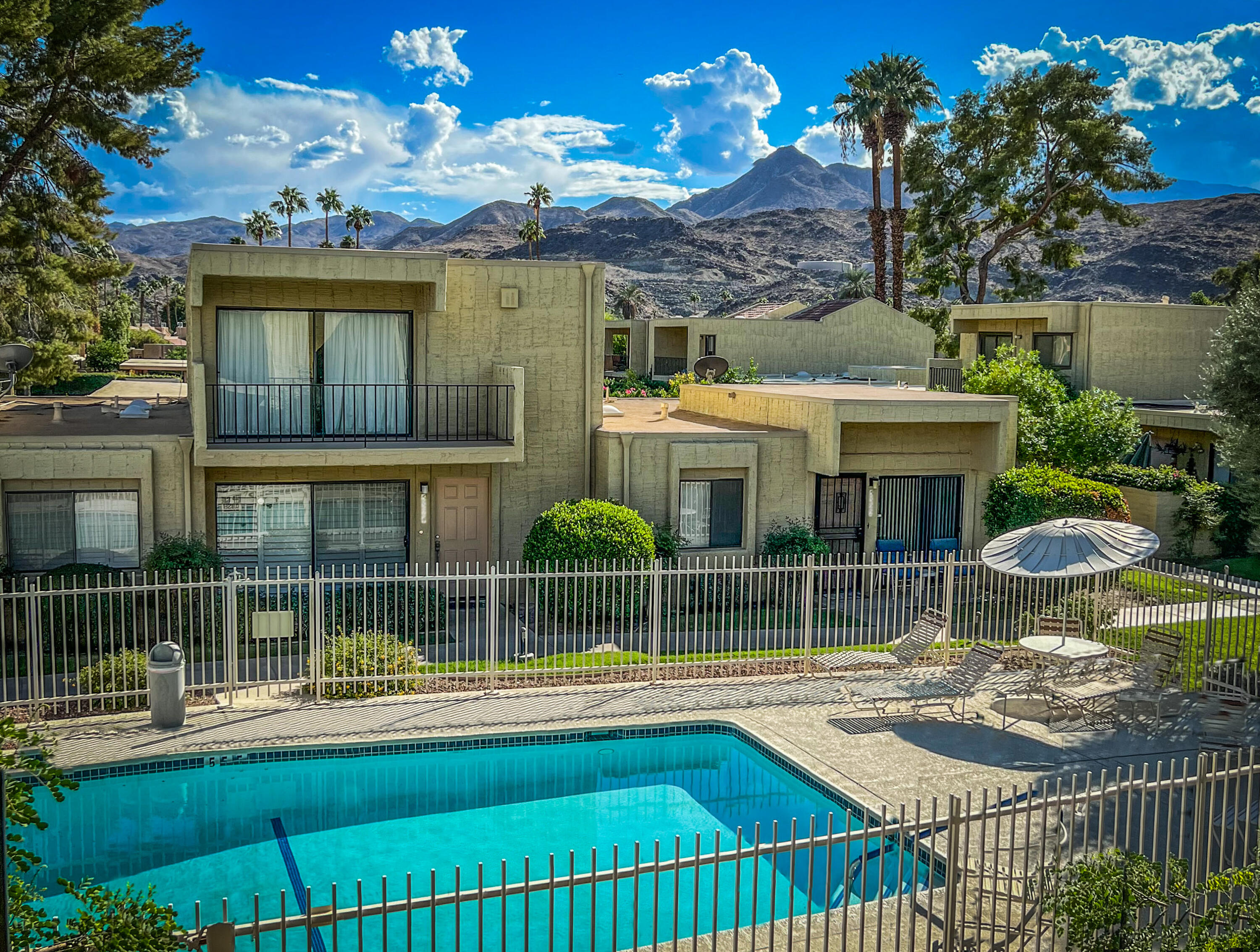2415 Los Patos Drive Palm Springs, CA 92264 - Photo 15 of 17 a view of a house with a backyard and a garden