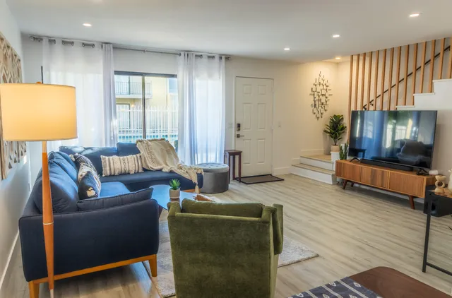 a living room with furniture and a flat screen tv