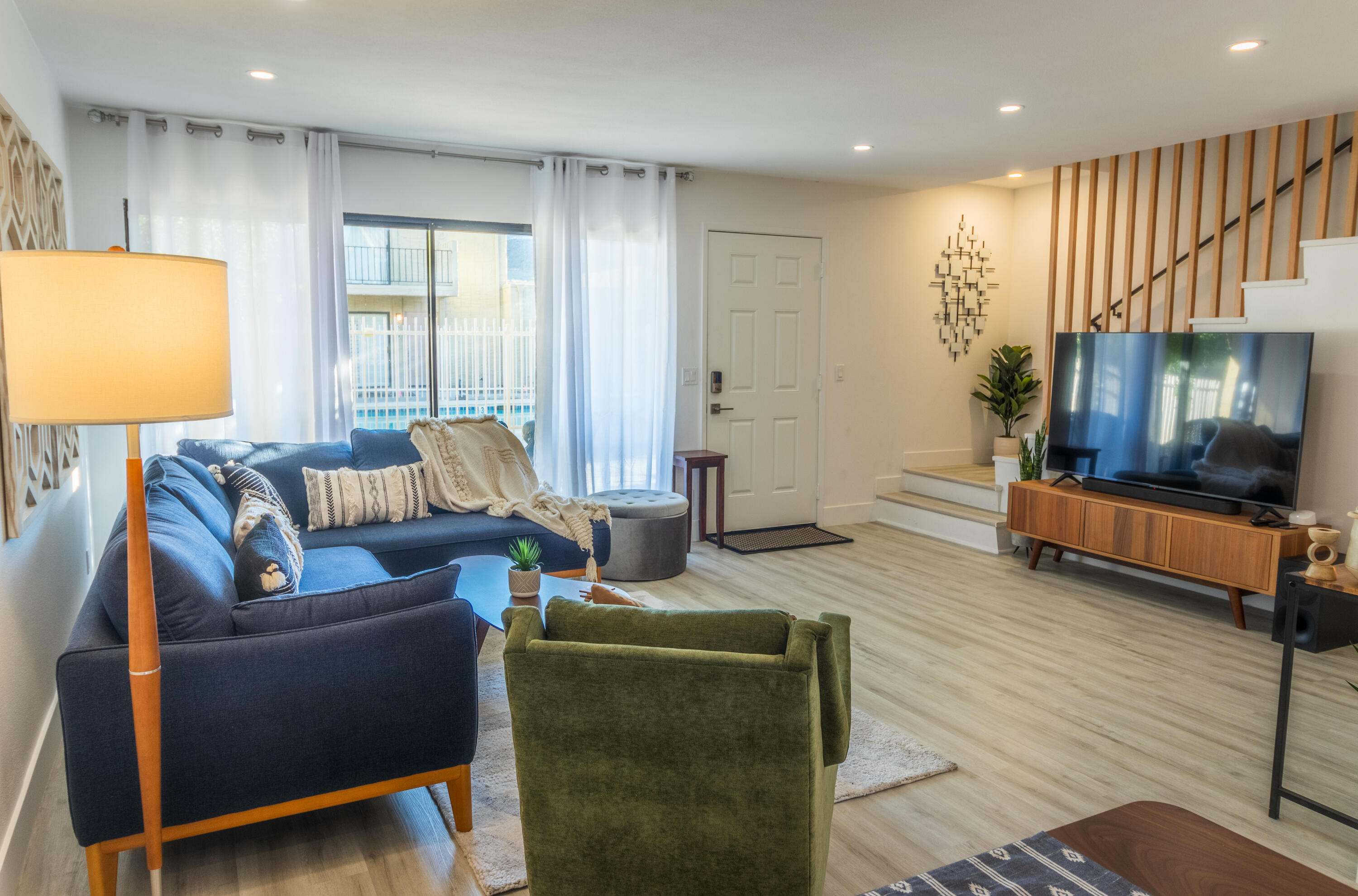 2415 Los Patos Drive Palm Springs, CA 92264 - Photo 2 of 17 a living room with furniture and a flat screen tv
