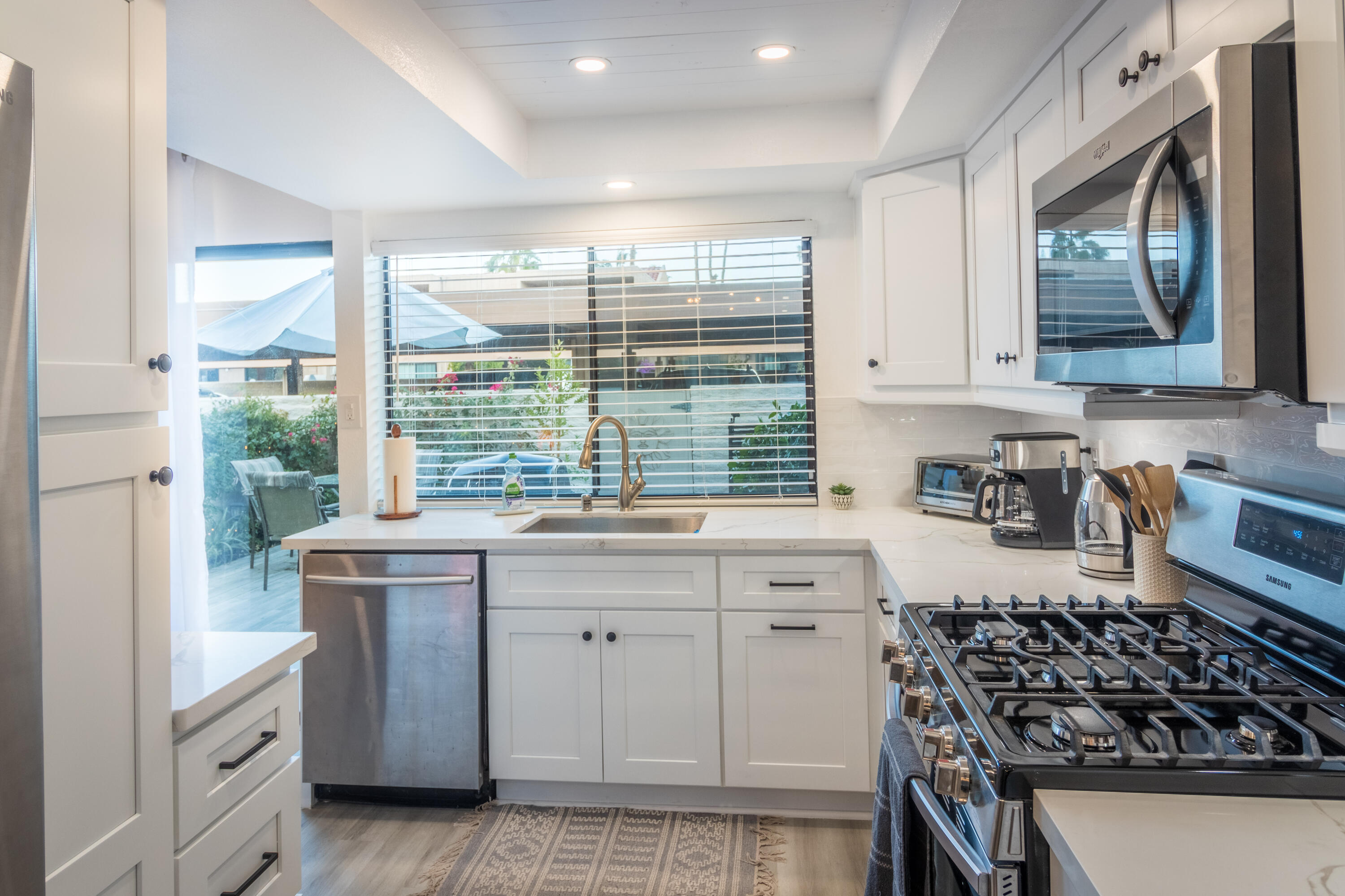 2415 Los Patos Drive Palm Springs, CA 92264 - Photo 5 of 17 a kitchen with stainless steel appliances a stove a sink and a refrigerator