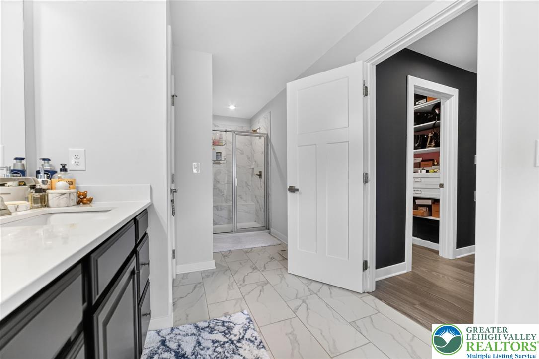 3952 Orth Street Bethlehem, PA 18020 - Photo 25 of 60 A well-appointed bathroom features a spacious shower and direct access to a functional walk-in closet.