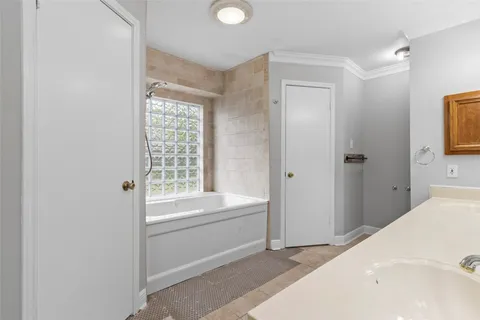 a bathroom with a bathtub and a sink