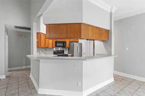 a kitchen with stainless steel appliances a sink and a cabinets