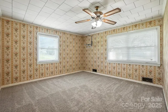 a view of an empty room and a window