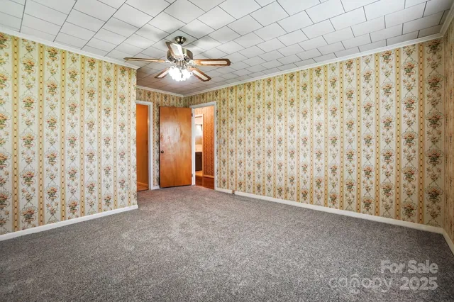 a view of an empty room and a window