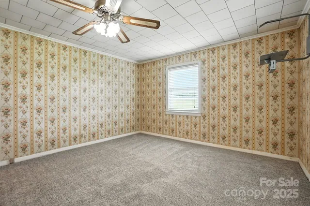 a bathroom with a granite countertop sink mirror and toilet