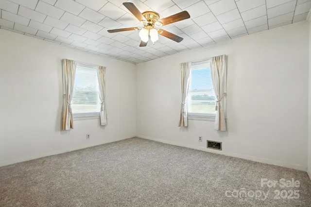 a bathroom with a double vanity sink a mirror and a shower