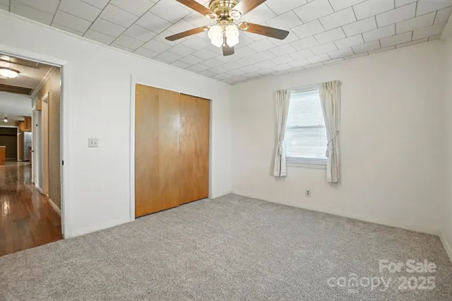 a bathroom with a toilet a sink and shower
