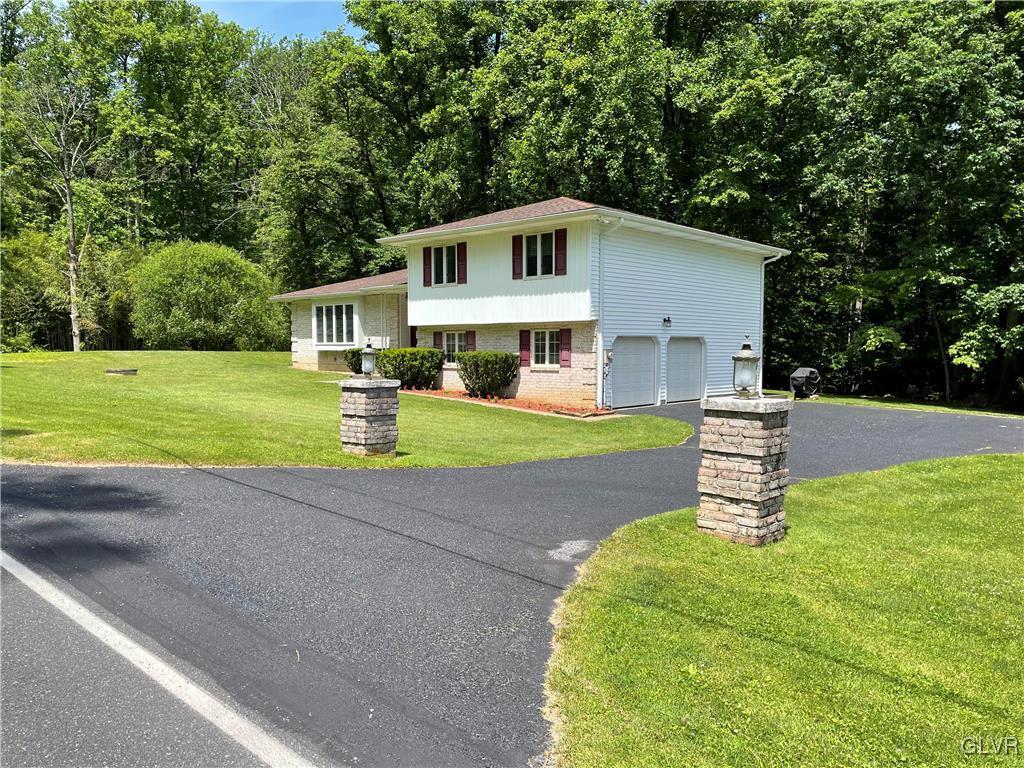 Two car garage with large driveway