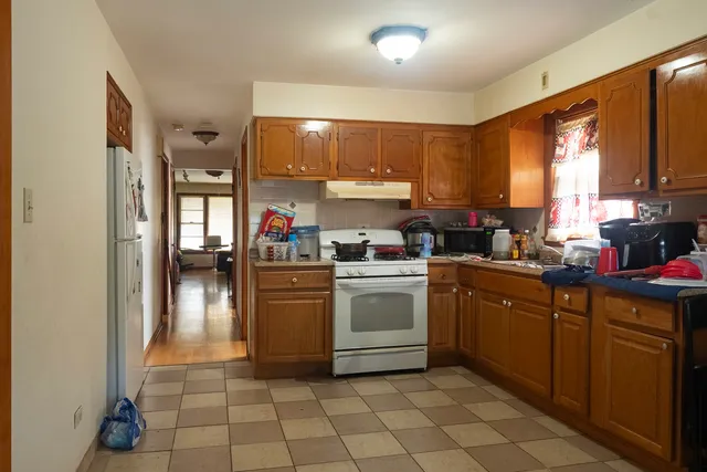 a kitchen with a sink cabinets and window