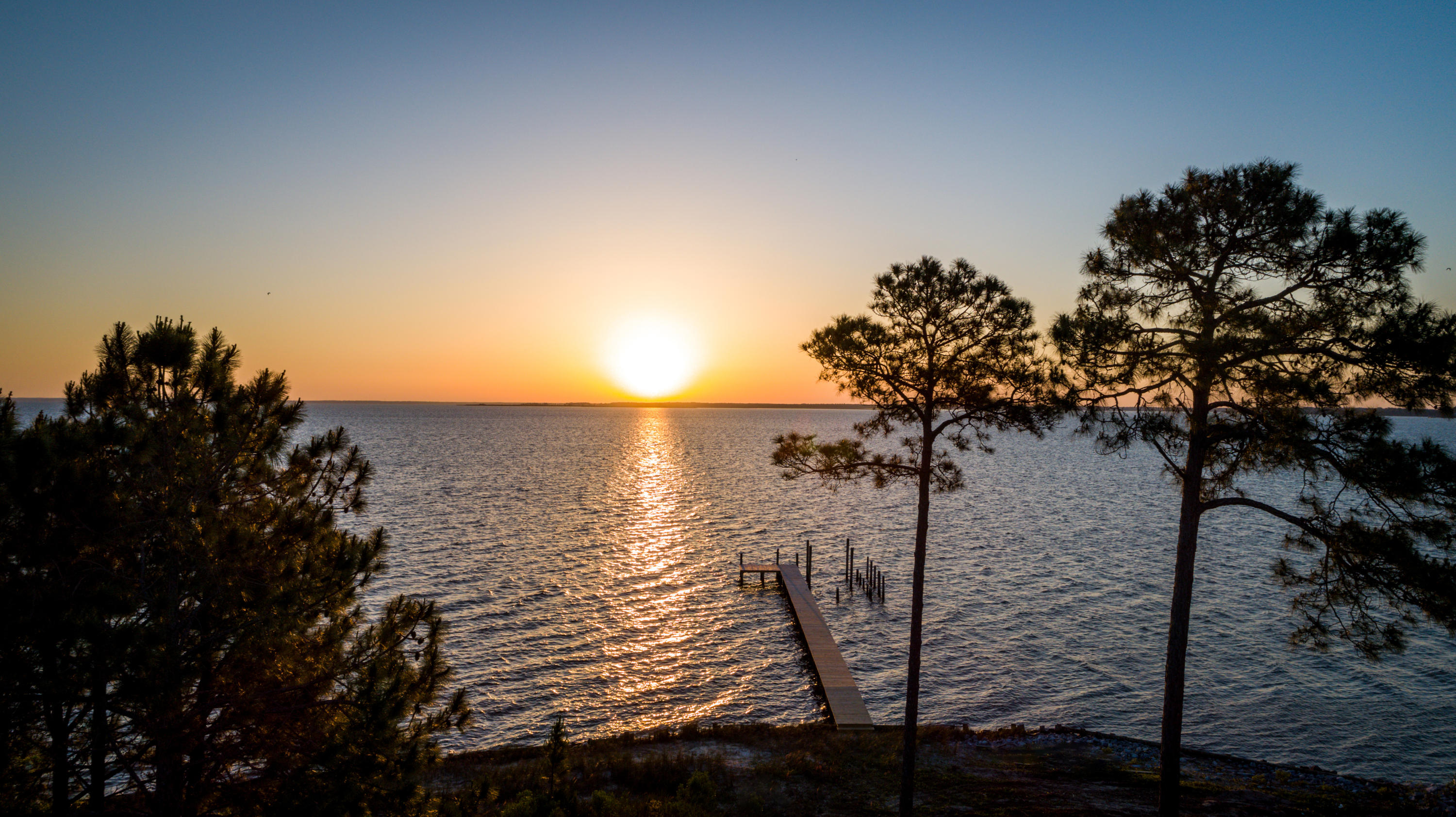 13-blk J Driftwood Point Road Santa Rosa Beach, FL 32459 - Photo 13 of 15 a view of a lake with a tree in the background