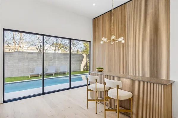 a bathroom with a sink mirror and shower