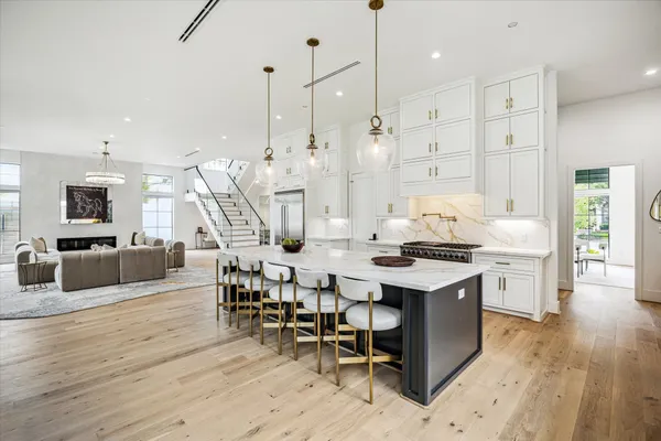 a living room with furniture and floor to ceiling window