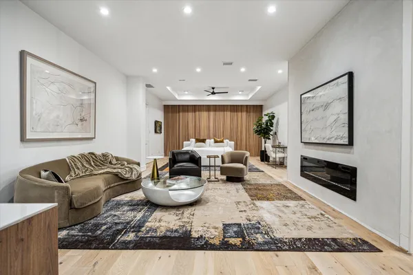 a bedroom with furniture and a fireplace