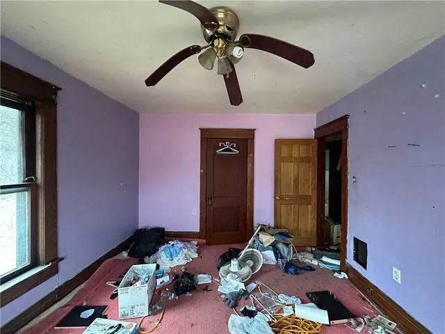 a bedroom with furniture and window