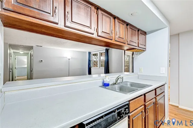 a kitchen with stainless steel appliances granite countertop a sink and cabinets