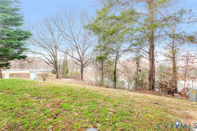 a view of large yard with a house