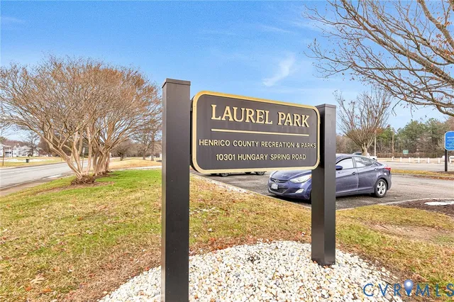 a view of a street with a building in the background