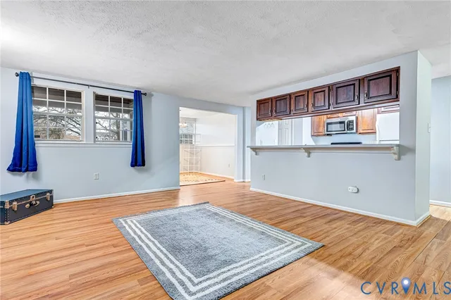 a view of a livingroom with wooden floor