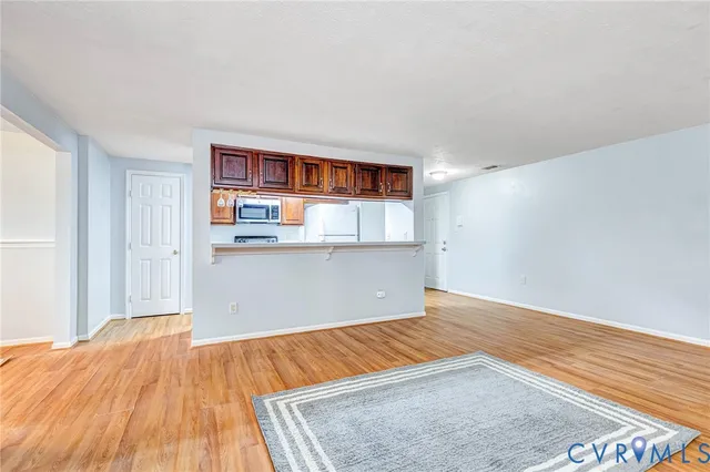 a view of kitchen and wooden floor