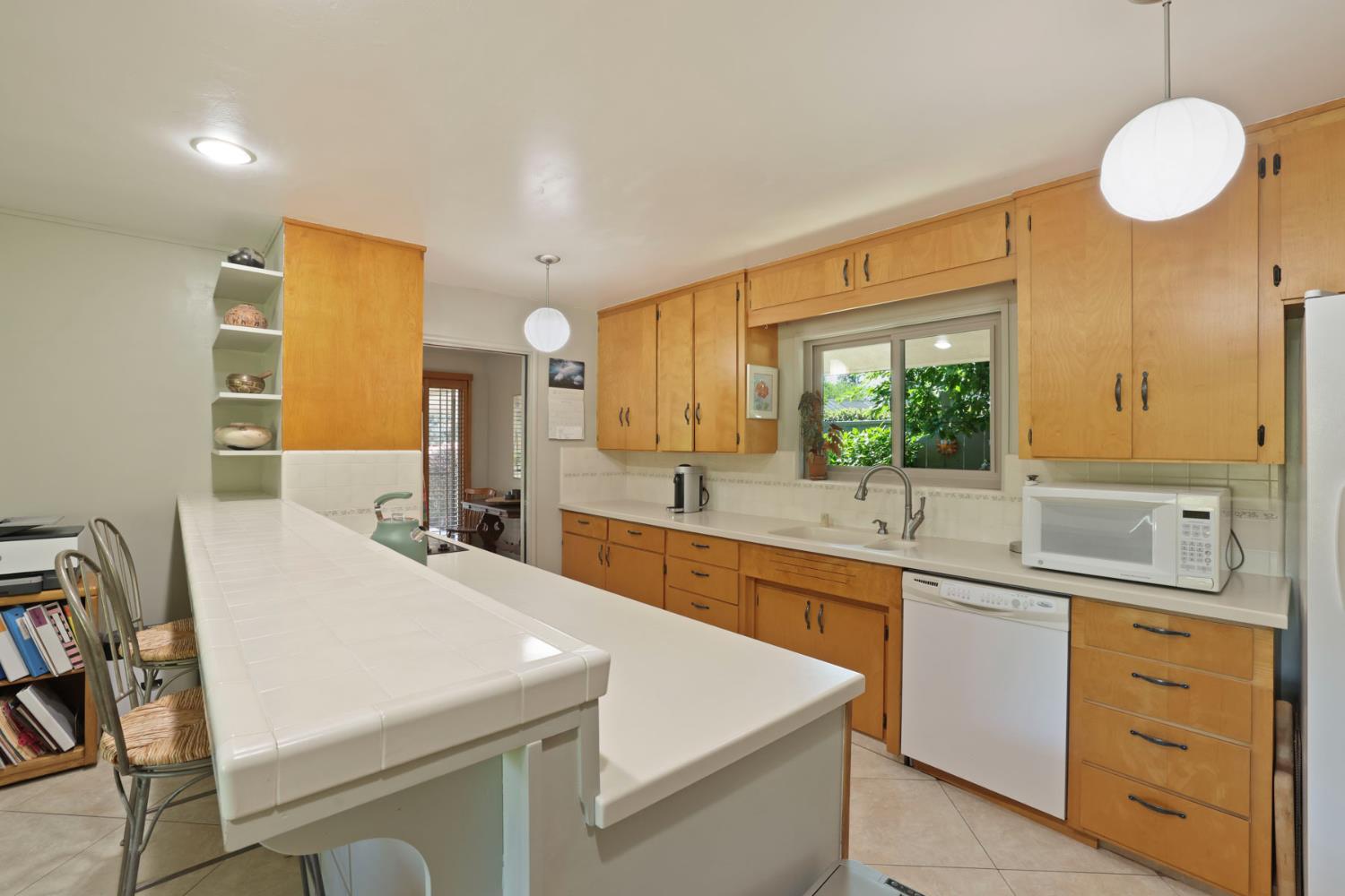 2406 Kenmore Court Modesto, CA 95350 - Photo 20 of 54 a kitchen with a sink and cabinets