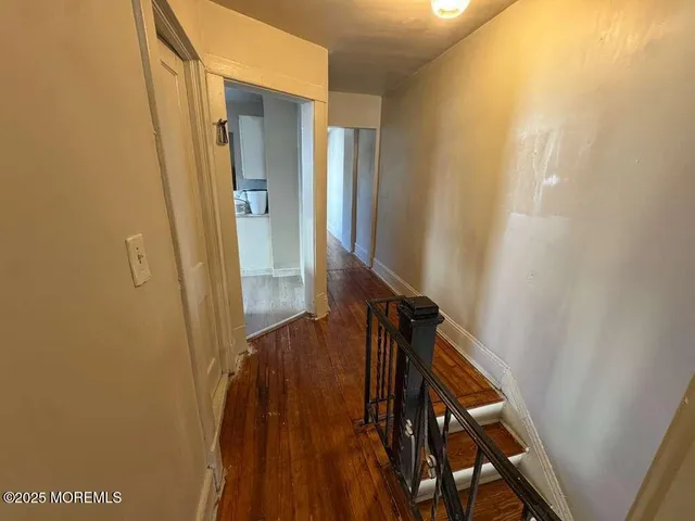 a view of hallway with stairs